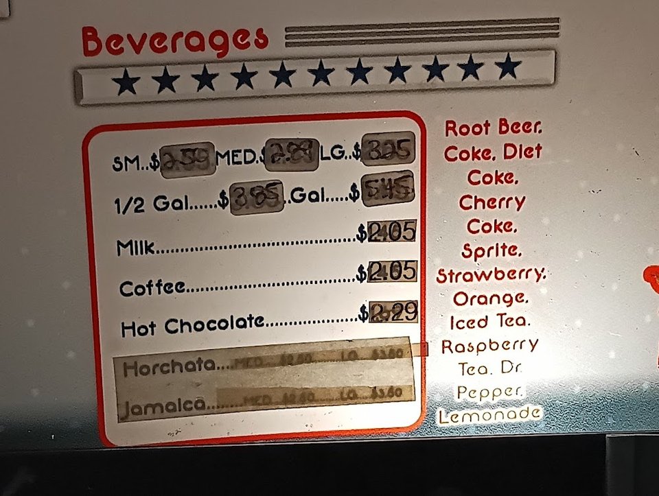 Printed menu with burgers and classic drive-in items.
